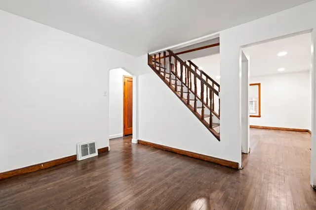 a view of an entryway with wooden floor