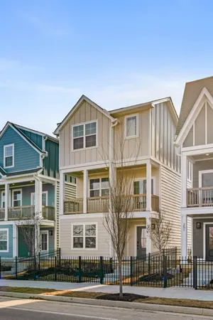 a front view of a building with a yard