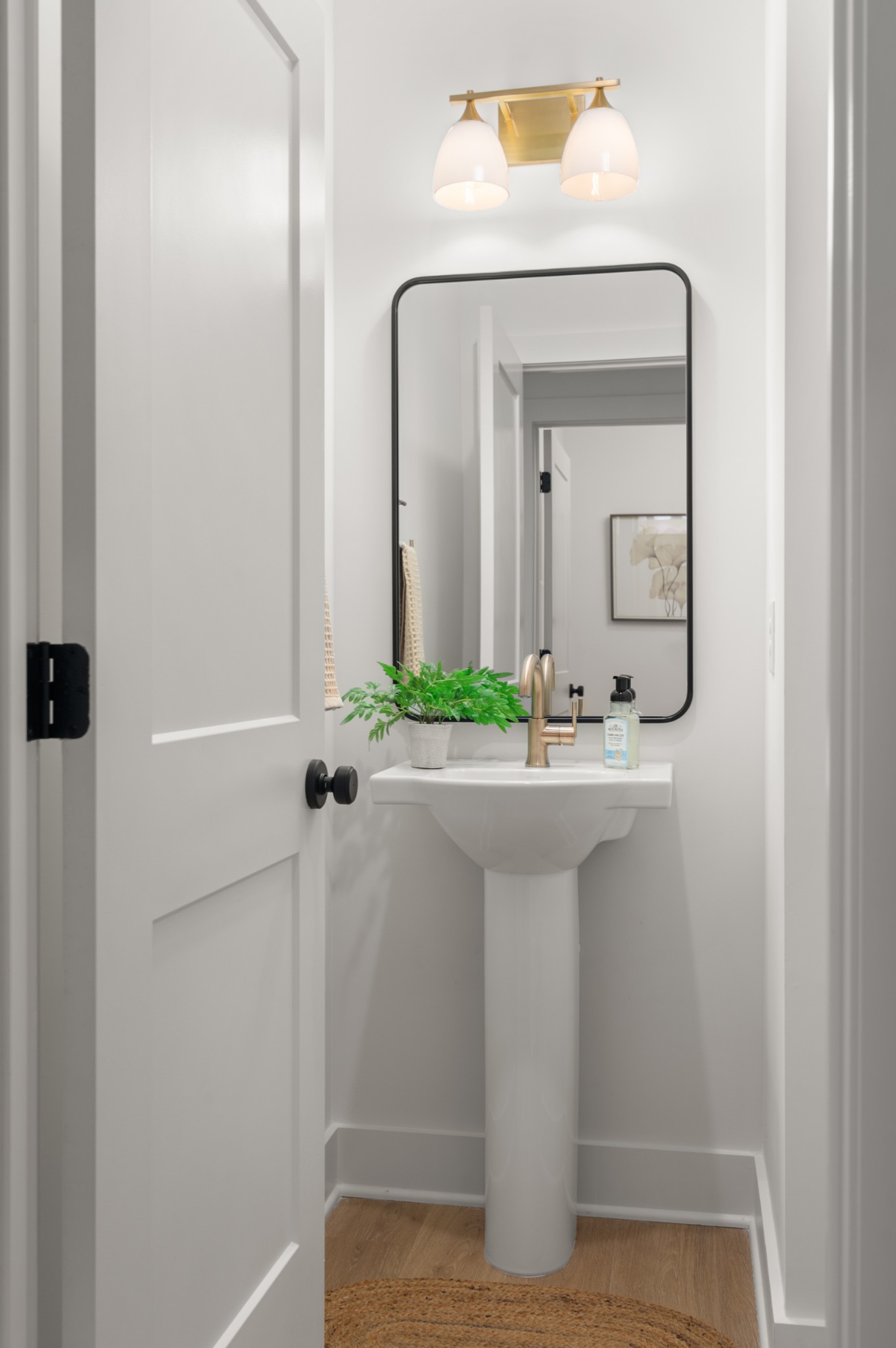 243 Nesbitt Lane Madison, TN 37115 - Photo 6 of 17 a bathroom with a sink a mirror and a shower