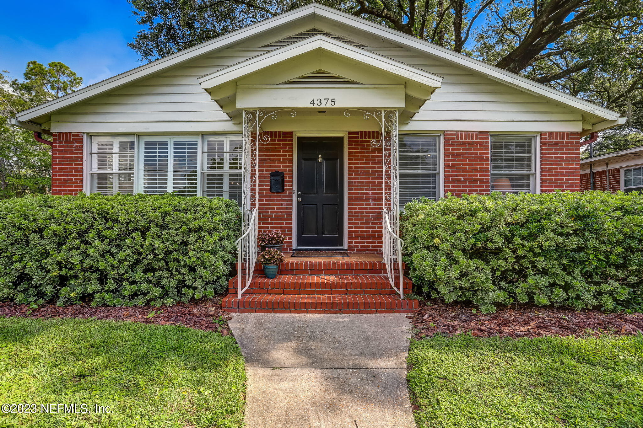 4375 Timuquana Road Jacksonville, FL 32210 - Photo 1 of 24 a front view of a house with a yard