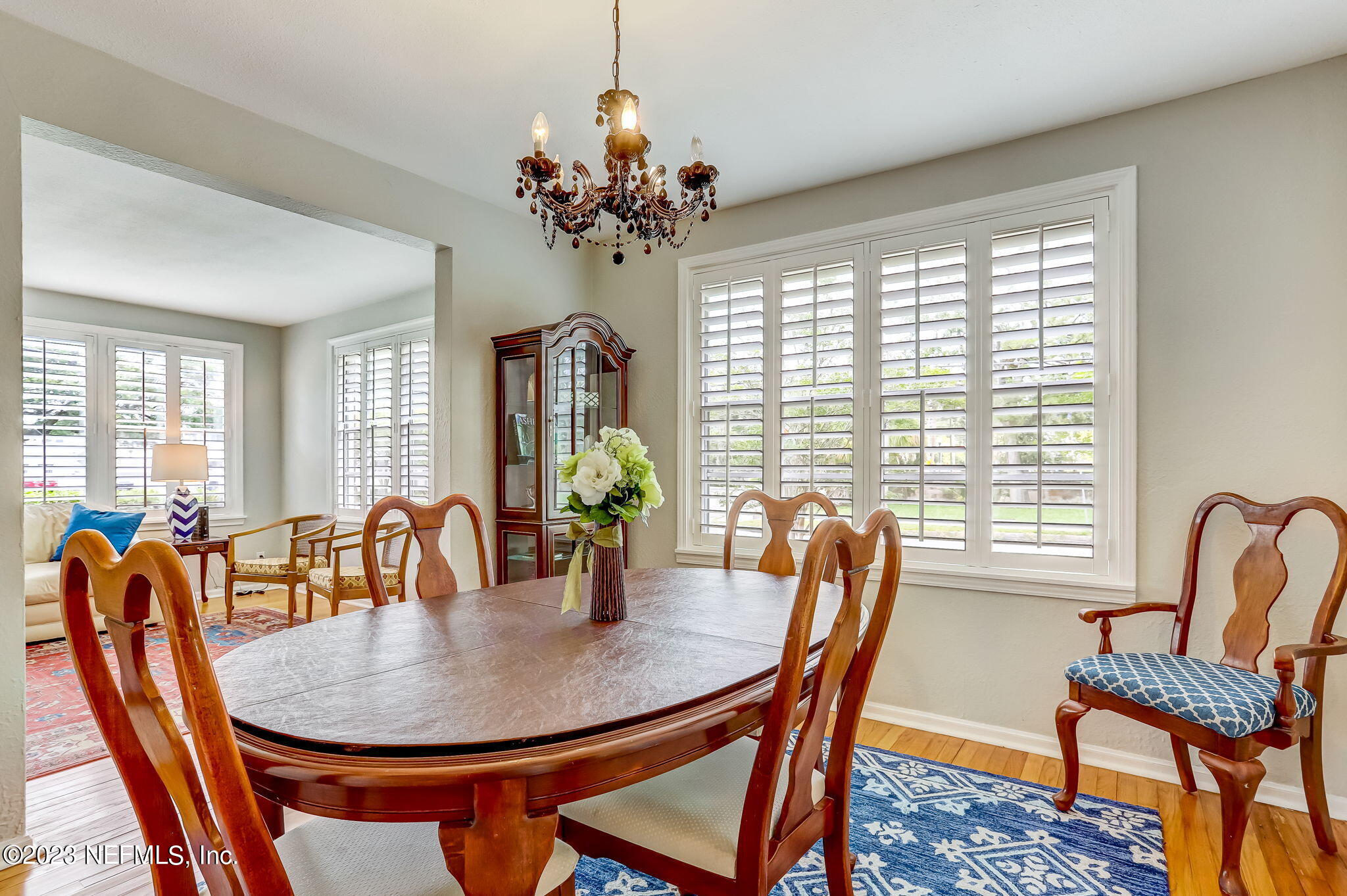 4375 Timuquana Road Jacksonville, FL 32210 - Photo 11 of 24 a dining room with furniture a chandelier and window