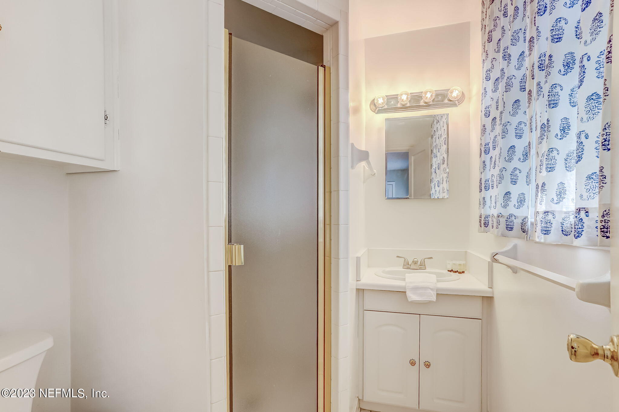 4375 Timuquana Road Jacksonville, FL 32210 - Photo 18 of 24 a bathroom with a sink a toilet and shower