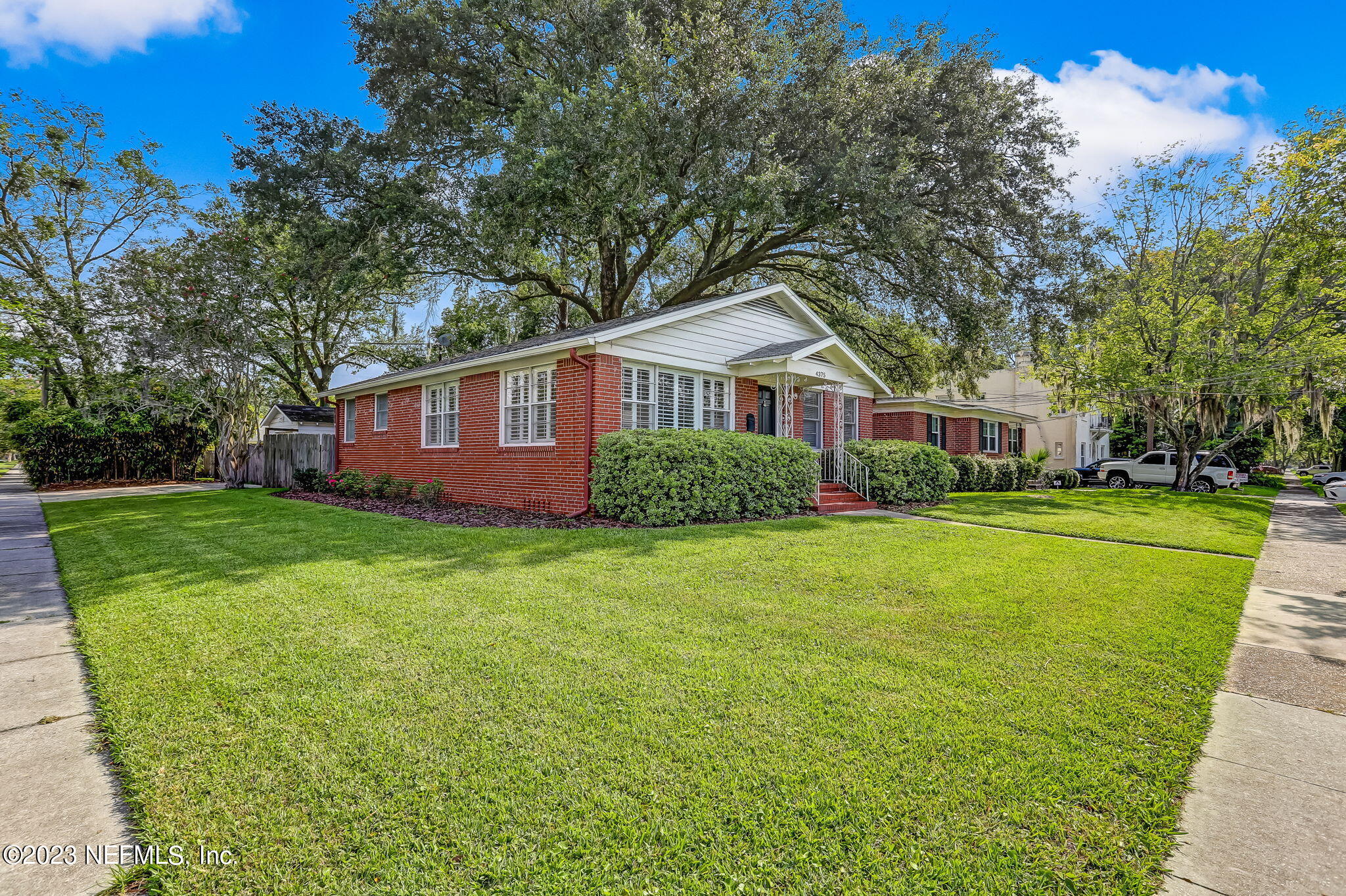4375 Timuquana Road Jacksonville, FL 32210 - Photo 2 of 24 a front view of a house with garden