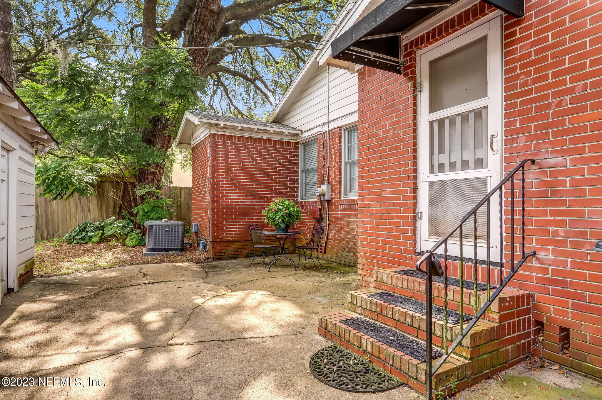 4375 Timuquana Road Jacksonville, FL 32210 - Photo 23 of 24 a backyard of a house with seating space