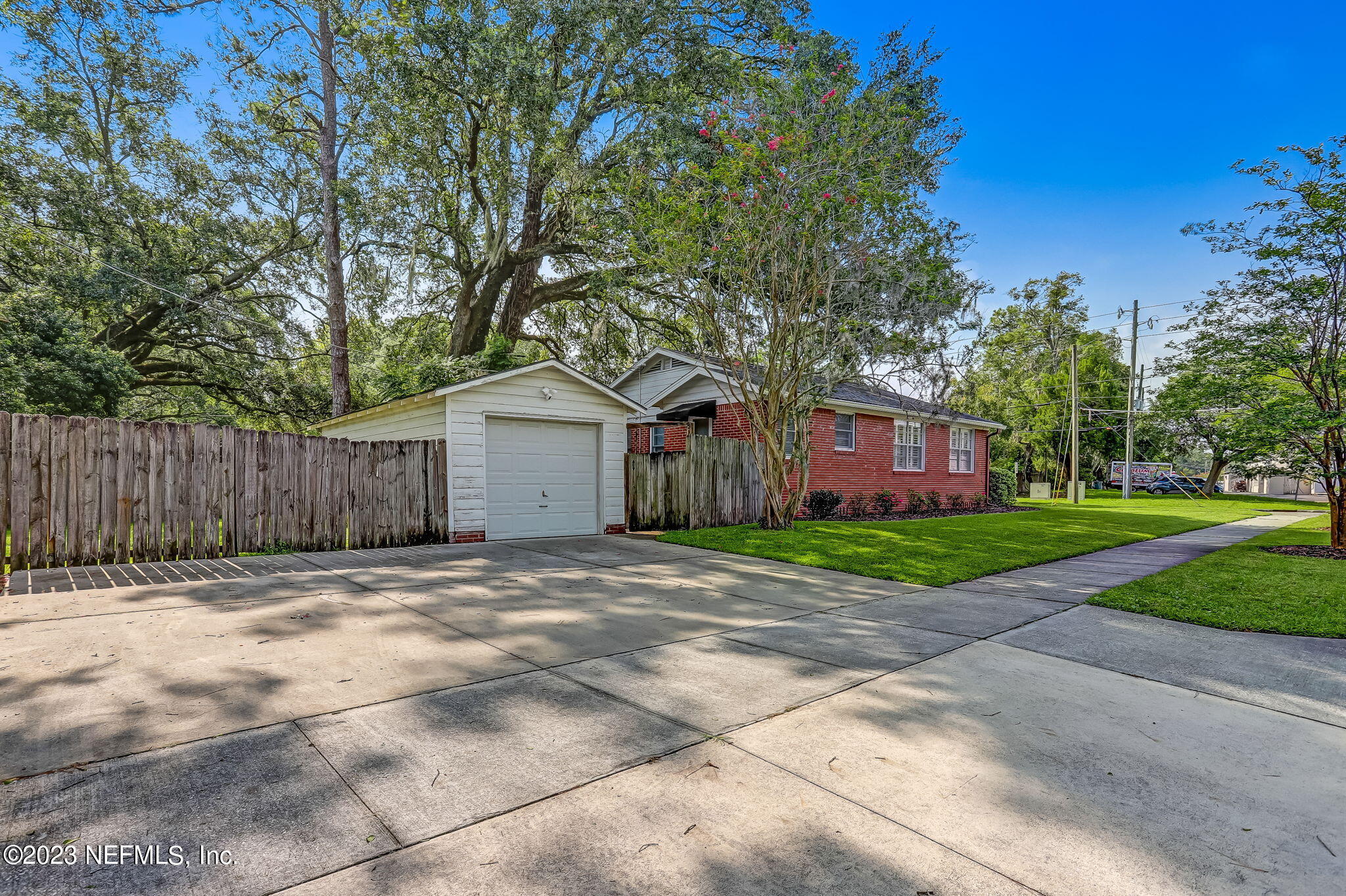 4375 Timuquana Road Jacksonville, FL 32210 - Photo 4 of 24 a view of a yard in front of a house