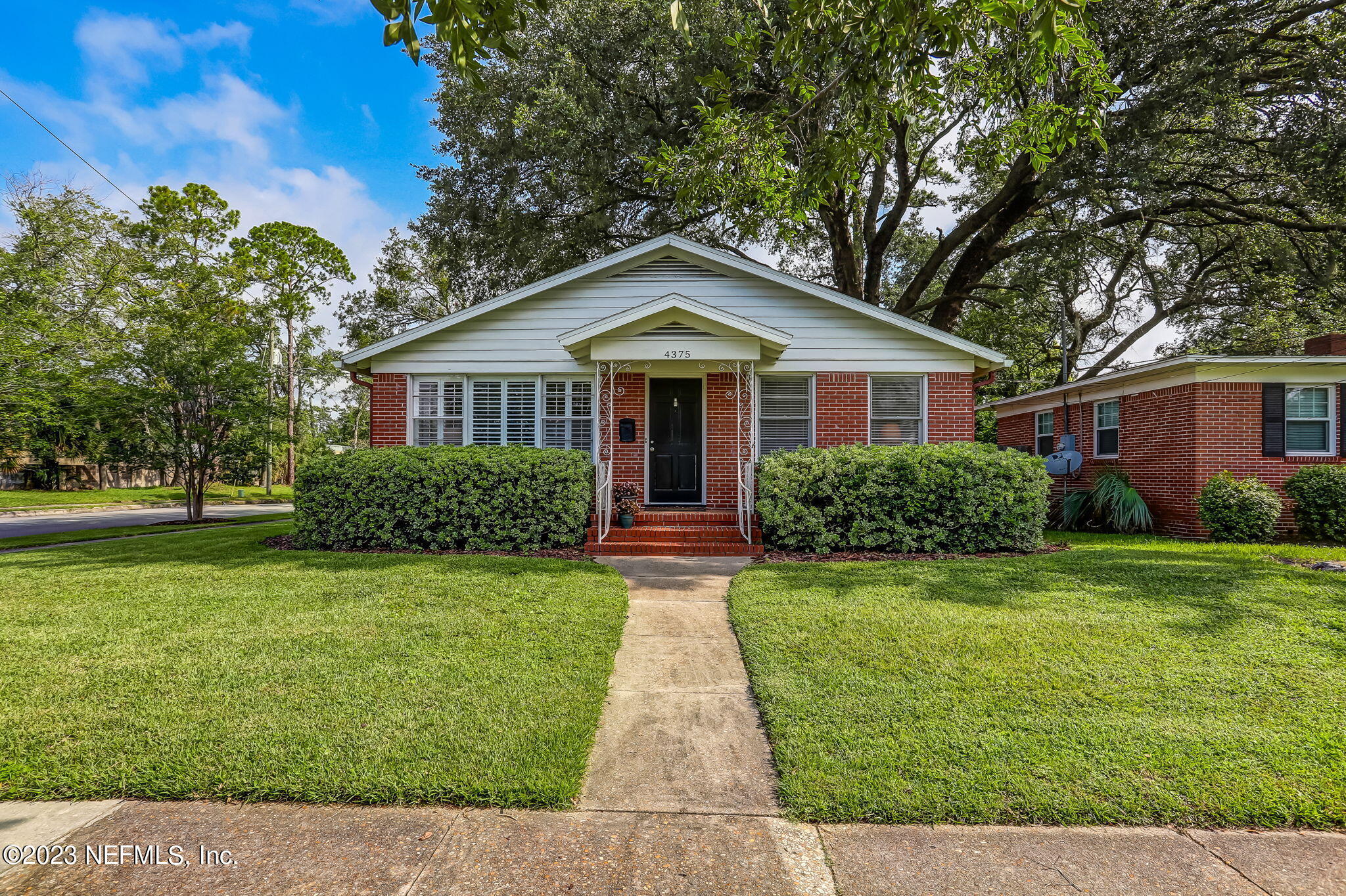 4375 Timuquana Road Jacksonville, FL 32210 - Photo 5 of 24 a front view of a house with a yard