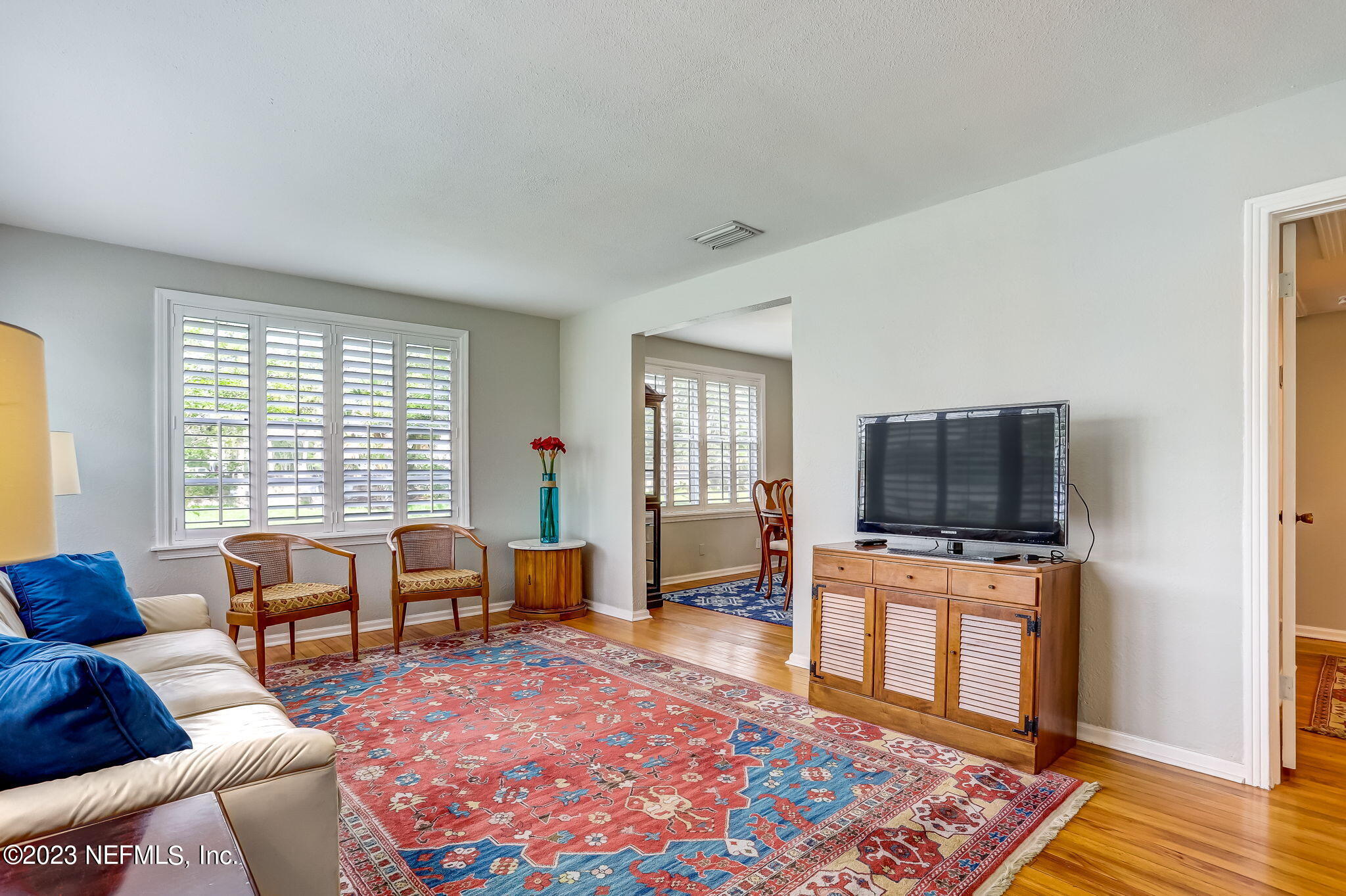 4375 Timuquana Road Jacksonville, FL 32210 - Photo 10 of 24 a living room with furniture and a flat screen tv