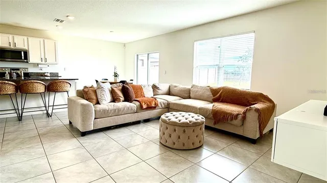 a living room with furniture and a window