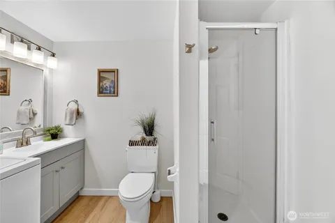 a bathroom with a toilet sink and shower