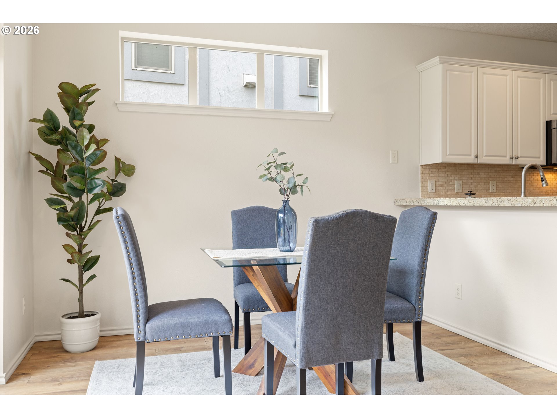 6512 Northwest 165th Avenue Portland, OR 97229 - Photo 13 of 42 a view of a dining room with furniture and wooden floor