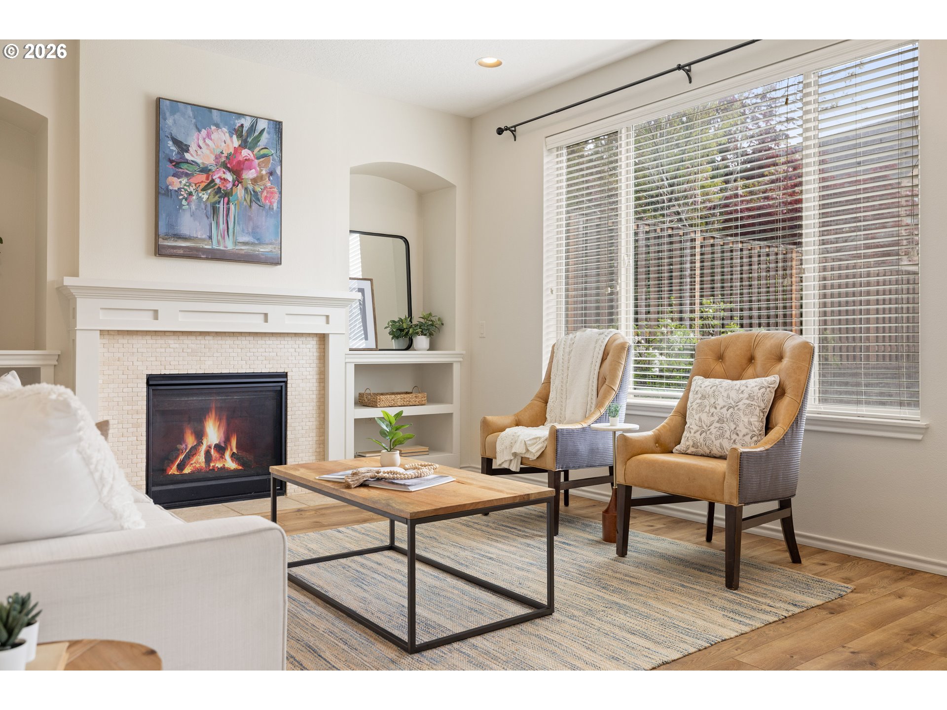 6512 Northwest 165th Avenue Portland, OR 97229 - Photo 17 of 42 a living room with furniture a window and a fireplace