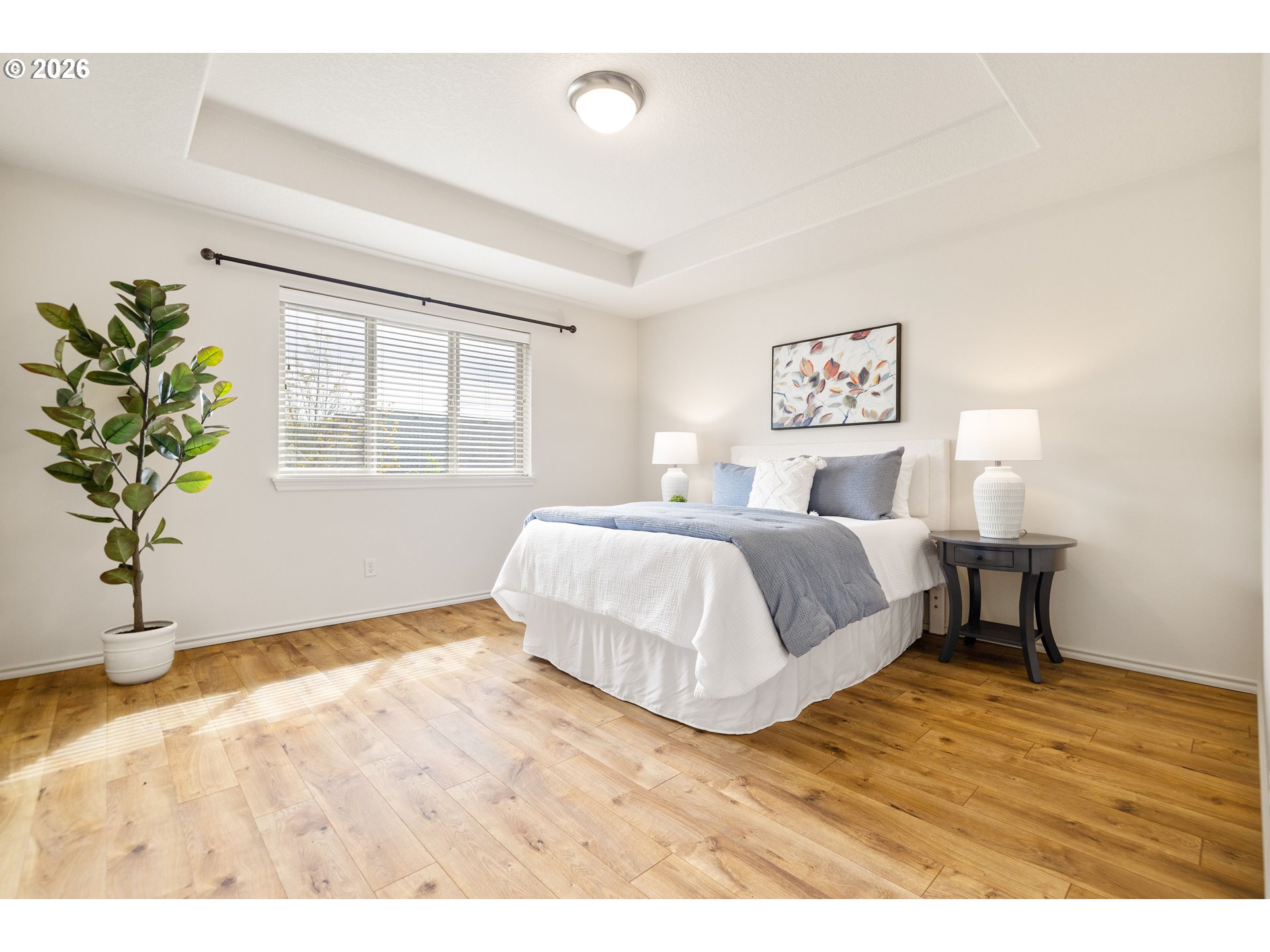 6512 Northwest 165th Avenue Portland, OR 97229 - Photo 19 of 42 a bedroom with a bed and a potted plant