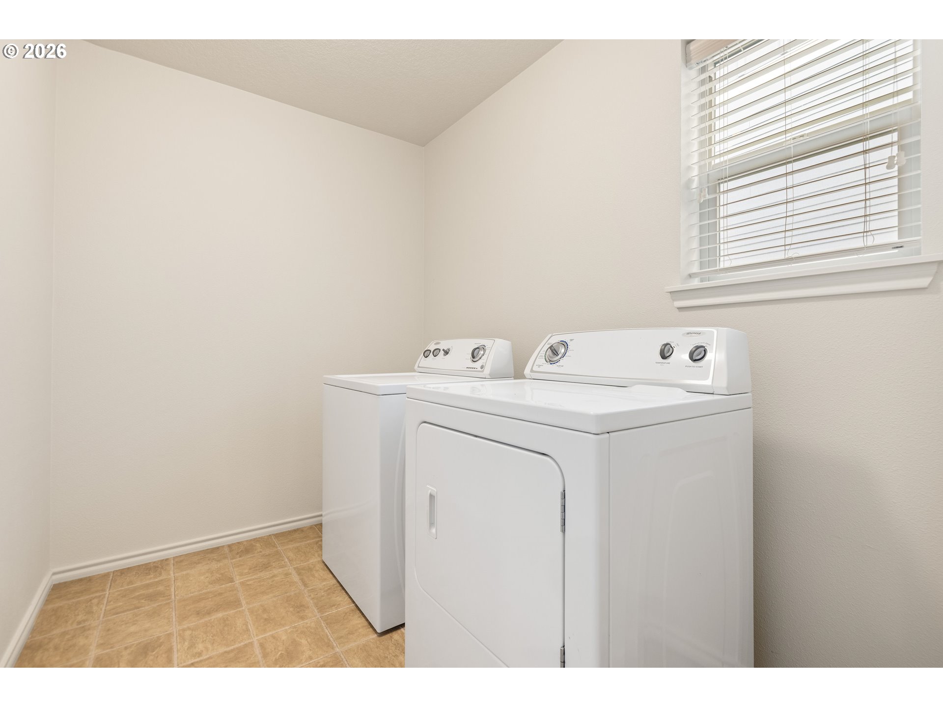 6512 Northwest 165th Avenue Portland, OR 97229 - Photo 29 of 42 a utility room with dryer and washer