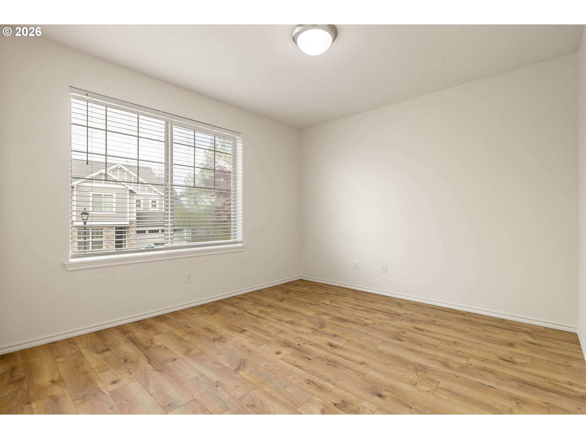 6512 Northwest 165th Avenue Portland, OR 97229 - Photo 32 of 42 a view of an empty room with a window