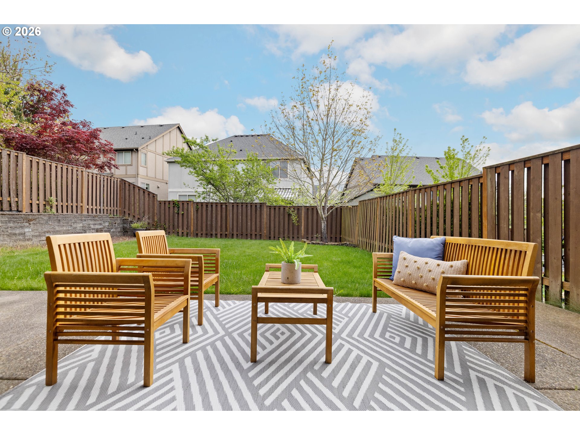 6512 Northwest 165th Avenue Portland, OR 97229 - Photo 37 of 42 a view of a chairs and tables in the back yard of the house