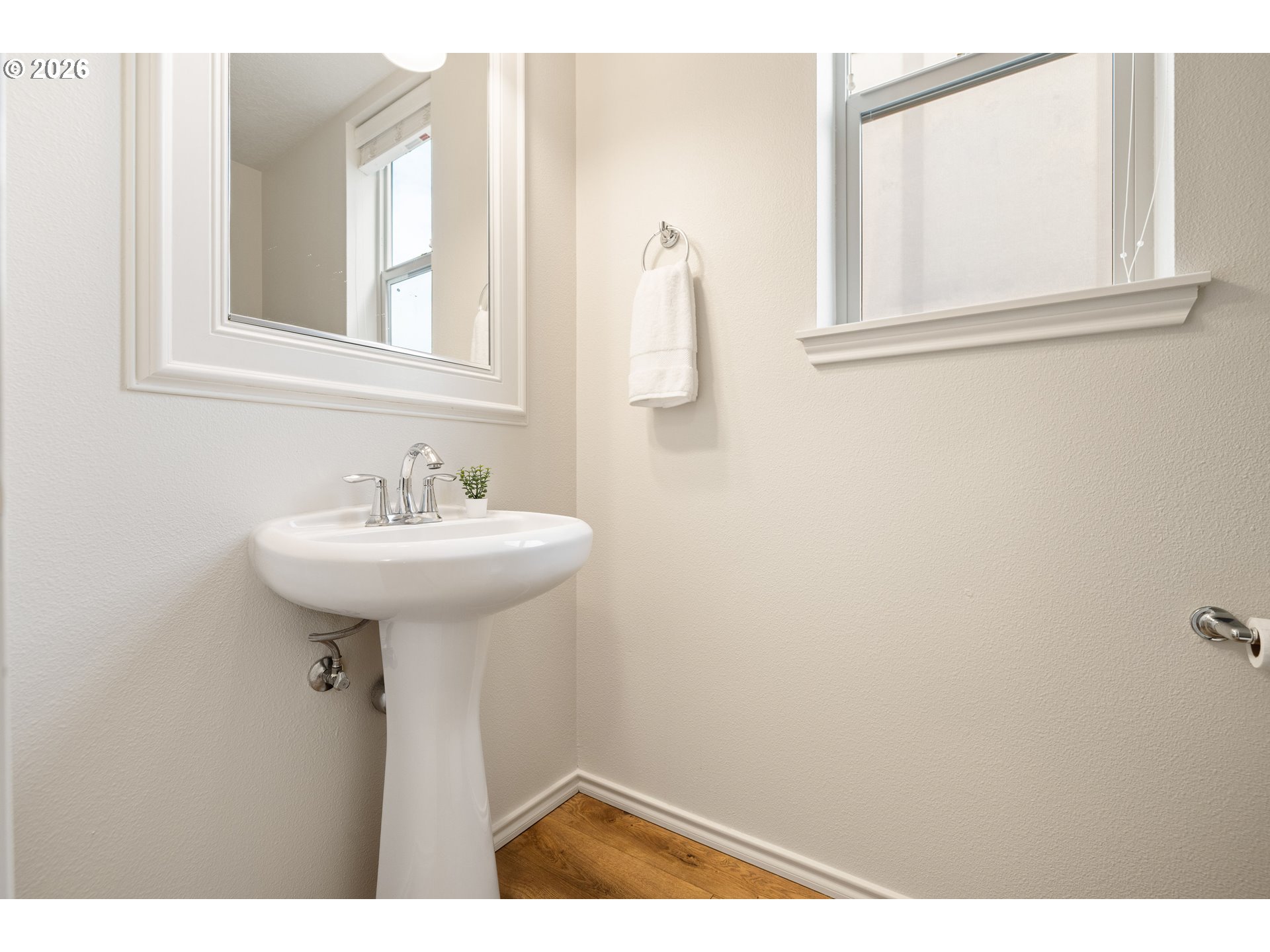 6512 Northwest 165th Avenue Portland, OR 97229 - Photo 7 of 42 a bathroom with a sink and a mirror