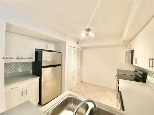 a view of a kitchen with a sink
