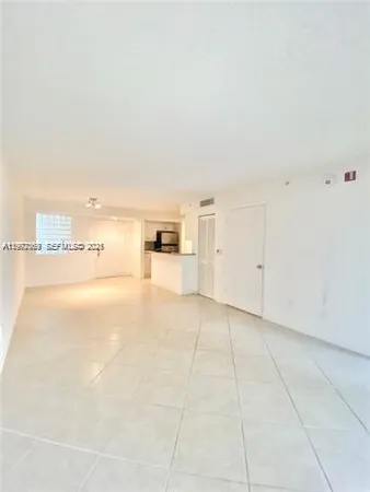 a view of a refrigerator with kitchen island