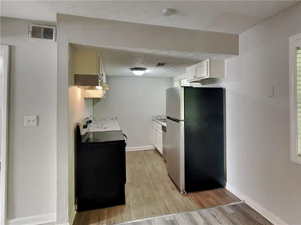 a bathroom with a sink toilet and a mirror