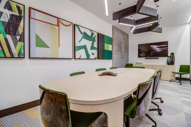 a view of a workspace with furniture