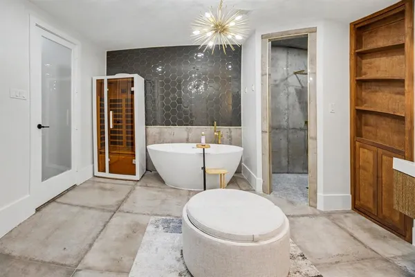a white toilet sitting next to a bathroom sink