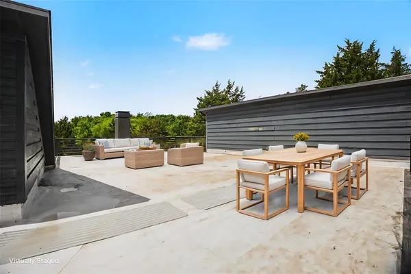 a view of an outdoor sitting area with chairs