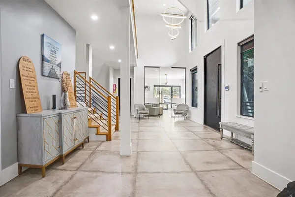 a view of entryway and hall with a living room