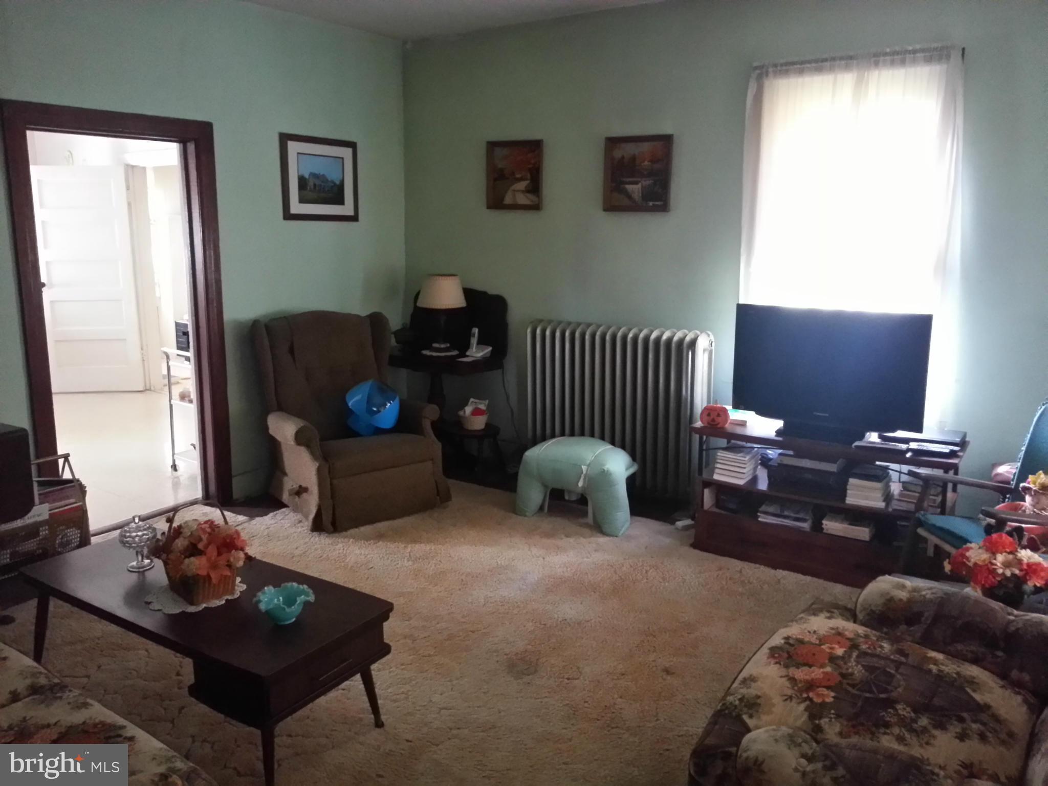 25307 Highfield Road Cascade, MD 21719 - Photo 10 of 16 a living room with furniture rug and window