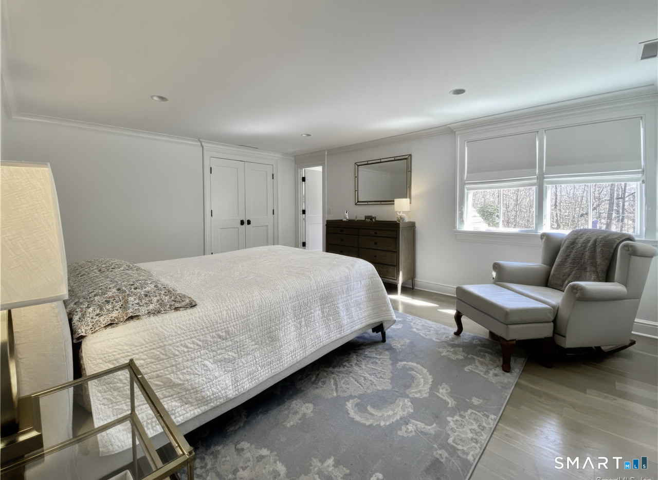 7 Whaling Road Darien, CT 06820 - Photo 21 of 34 a bedroom with a bed and a couch