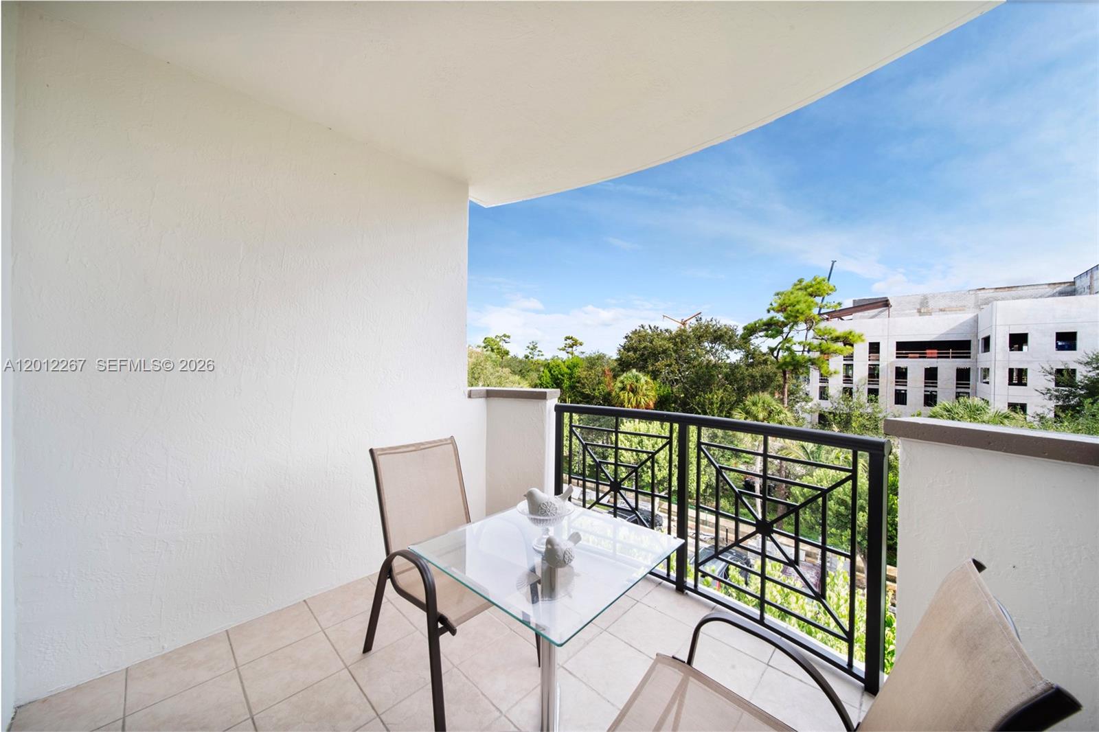 9021 Southwest 94th Street, Unit 310 Miami, FL 33176 - Photo 35 of 41 a view of a balcony with furniture