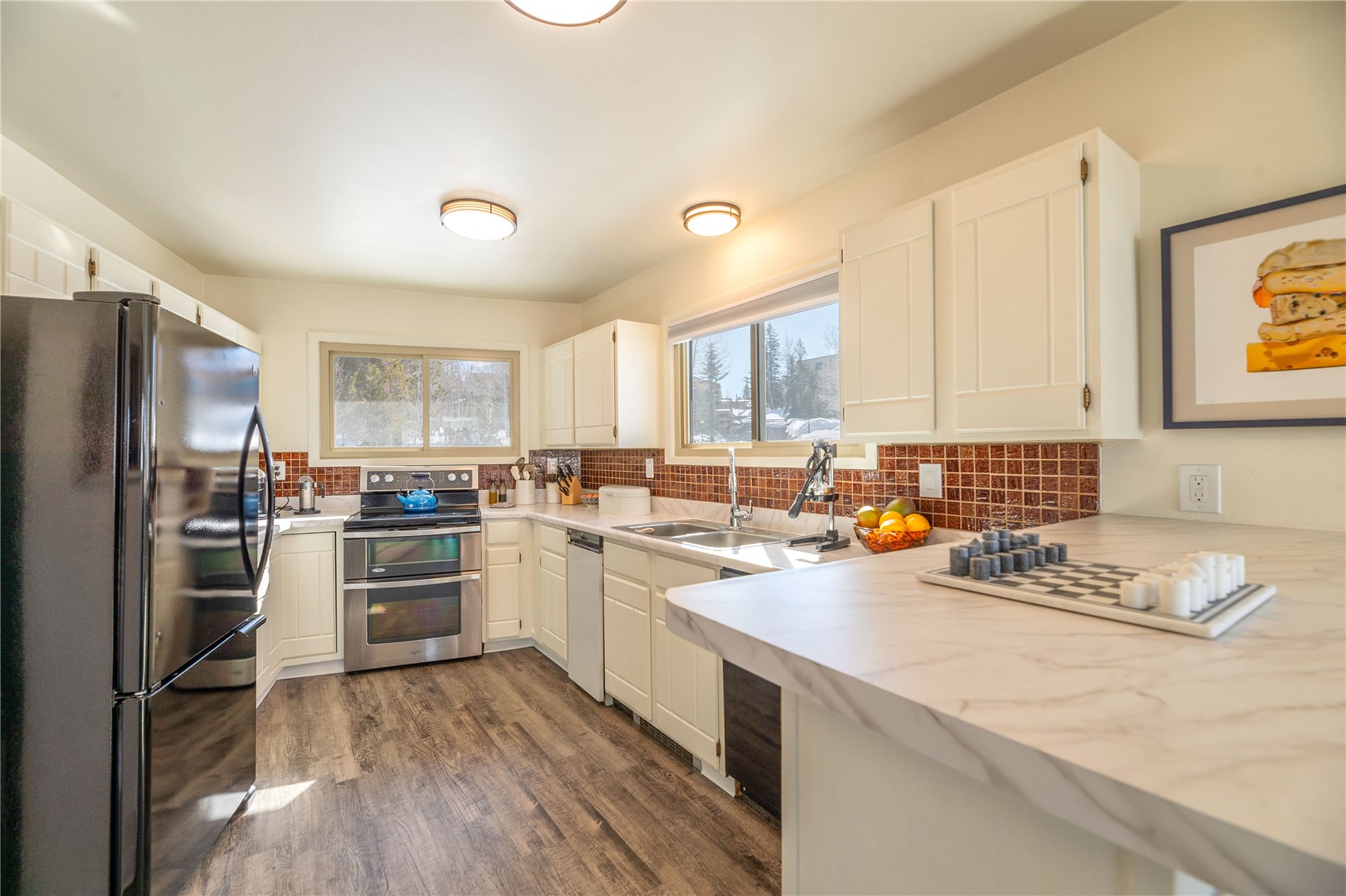 340 Buffalo Street Dillon, CO 80435 - Photo 16 of 40 a kitchen with a refrigerator stove and sink