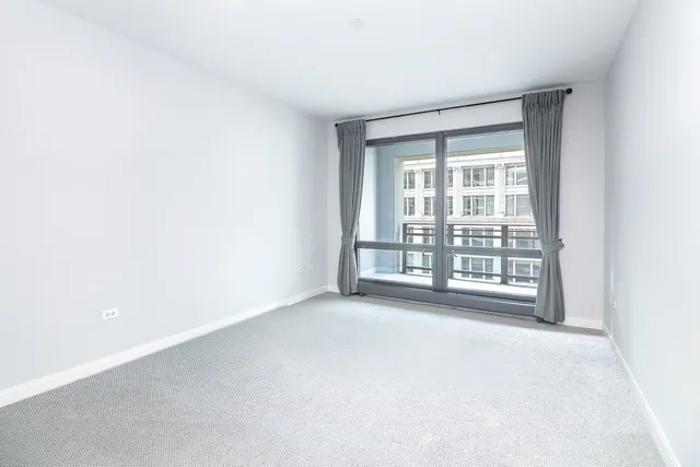 a bathroom with a granite countertop sink tub shower and a mirror