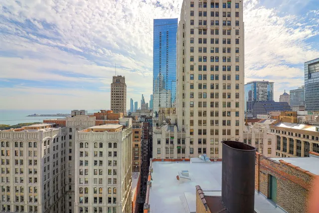 a view of swimming pool with outdoor seating