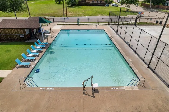 a view of a swimming pool with a patio