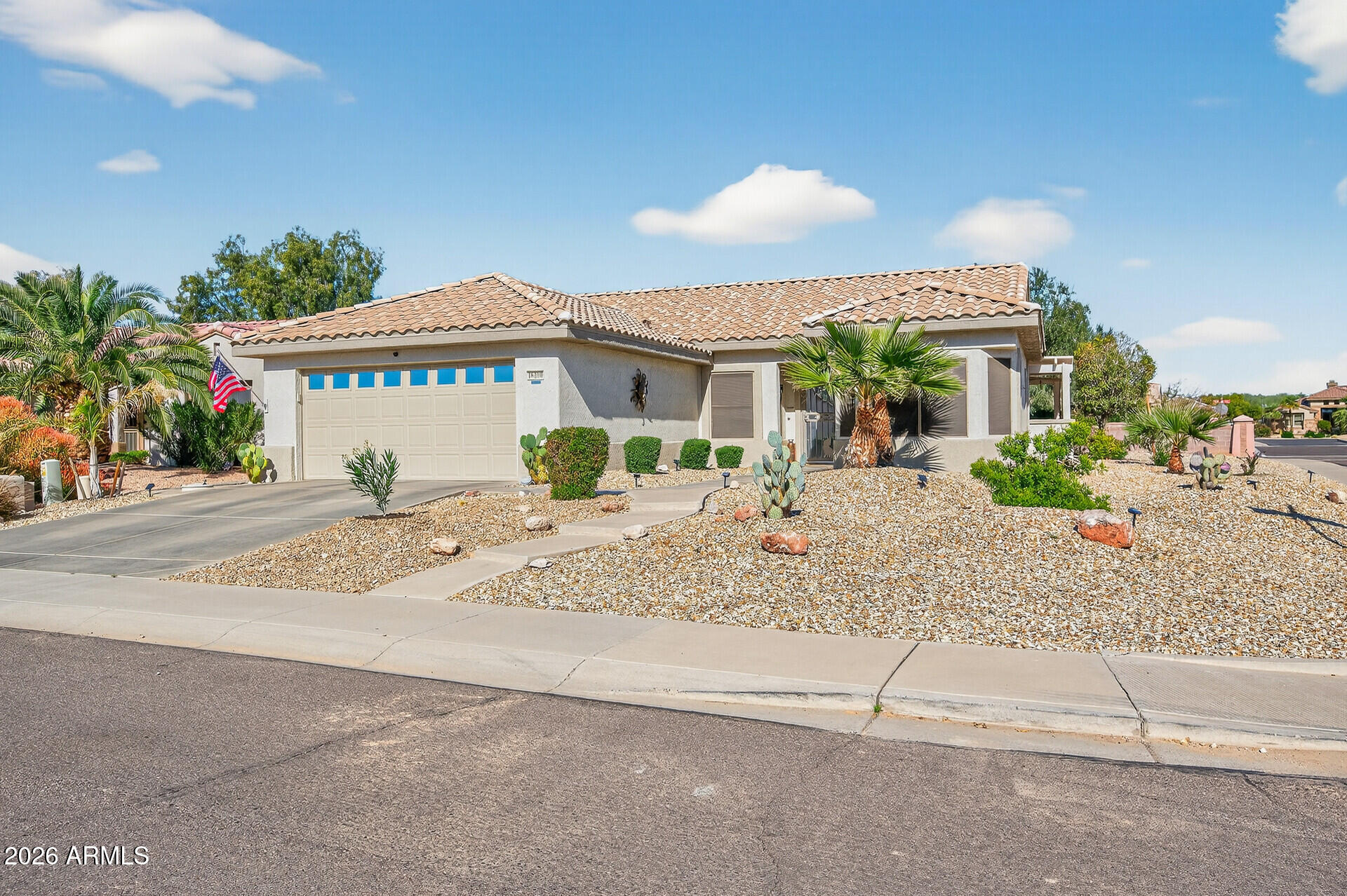 16100 West Eagle Ridge Drive Surprise, AZ 85374 - Photo 2 of 44 a view of a house next to a yard