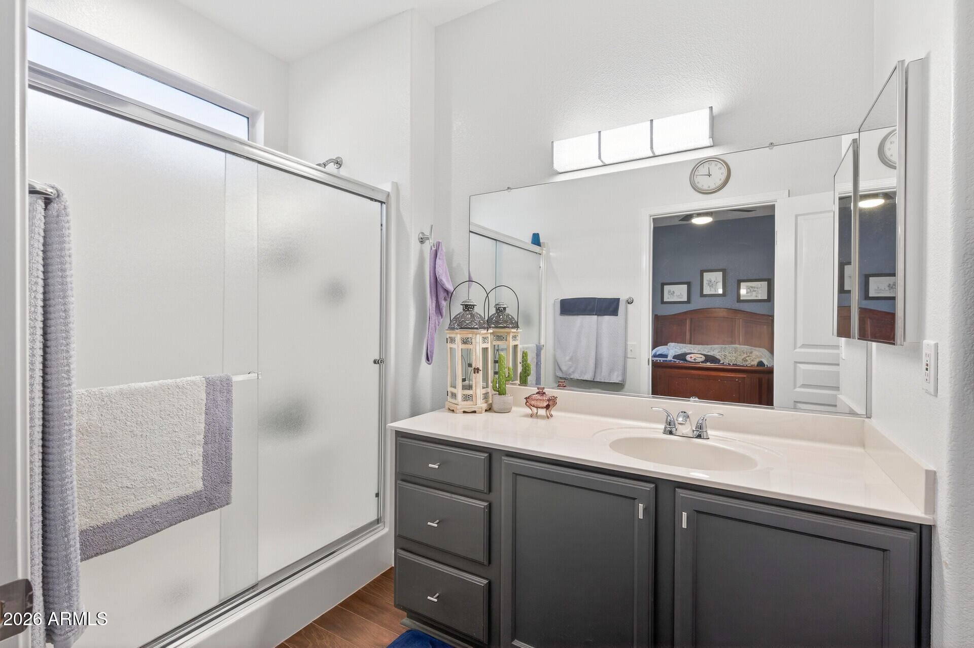 16100 West Eagle Ridge Drive Surprise, AZ 85374 - Photo 24 of 44 a bathroom with a double vanity sink mirror and shower