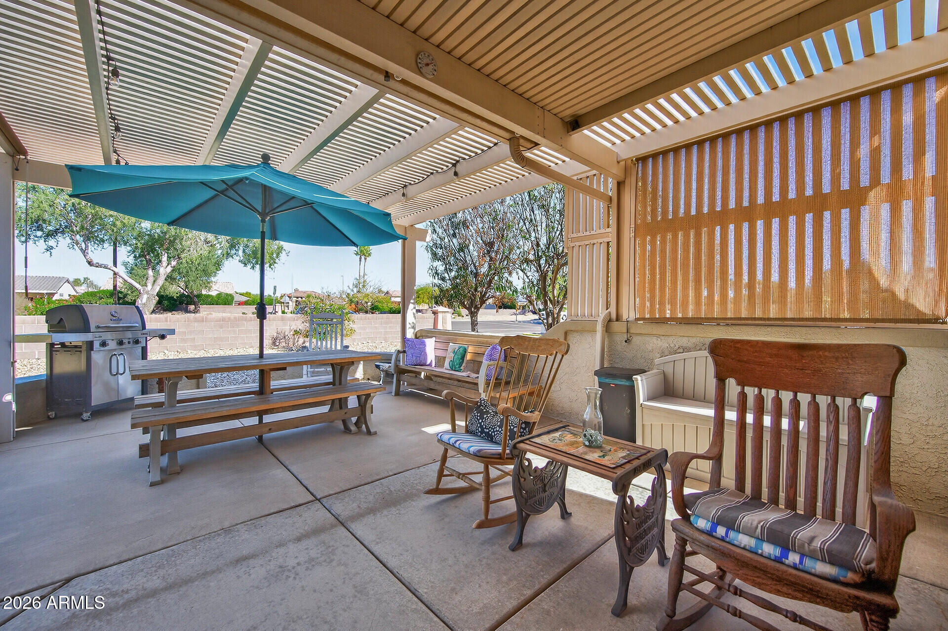 16100 West Eagle Ridge Drive Surprise, AZ 85374 - Photo 34 of 44 a view of a patio with a table and chairs