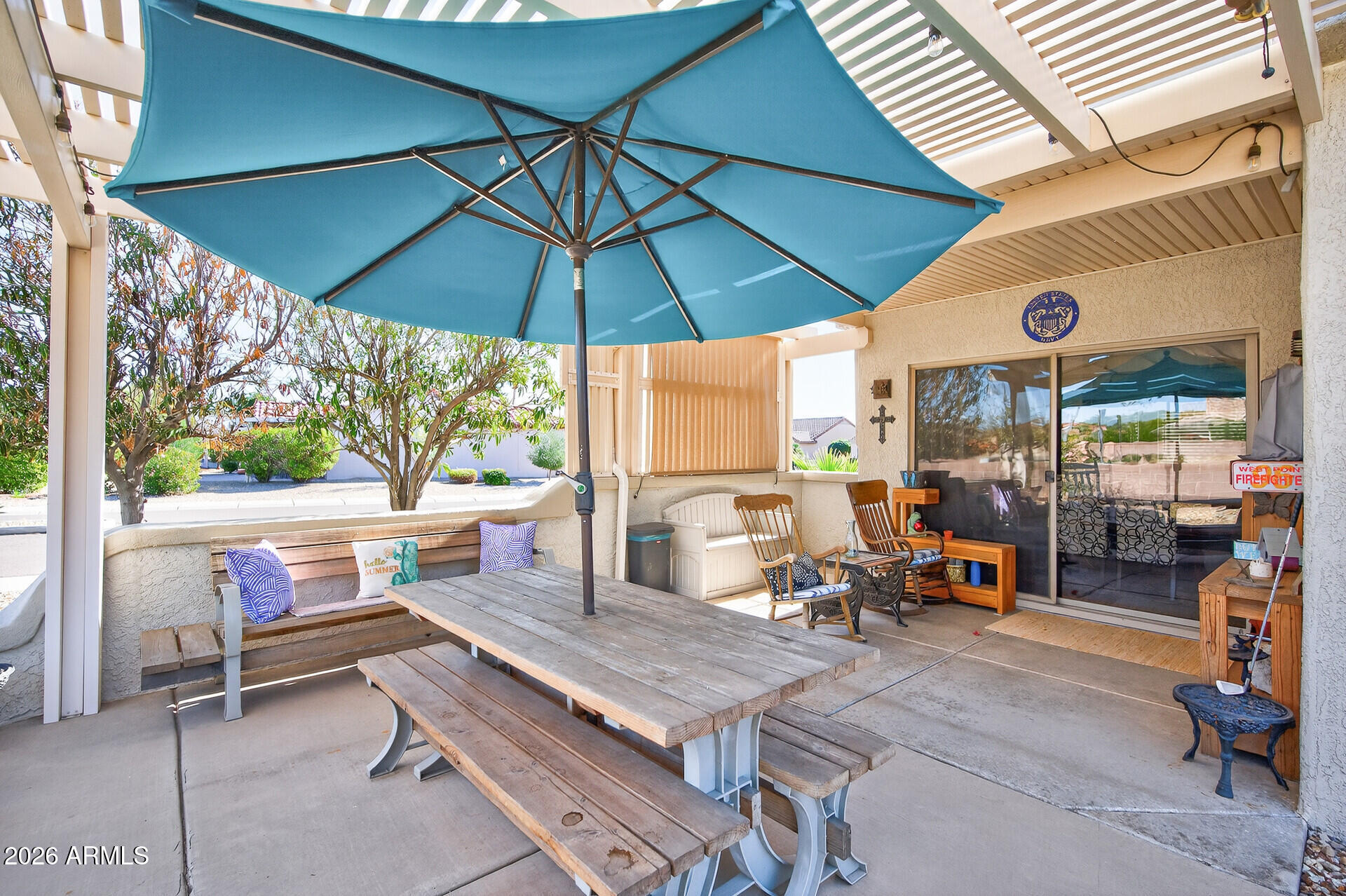 16100 West Eagle Ridge Drive Surprise, AZ 85374 - Photo 38 of 44 an outdoor sitting area with furniture and umbrella