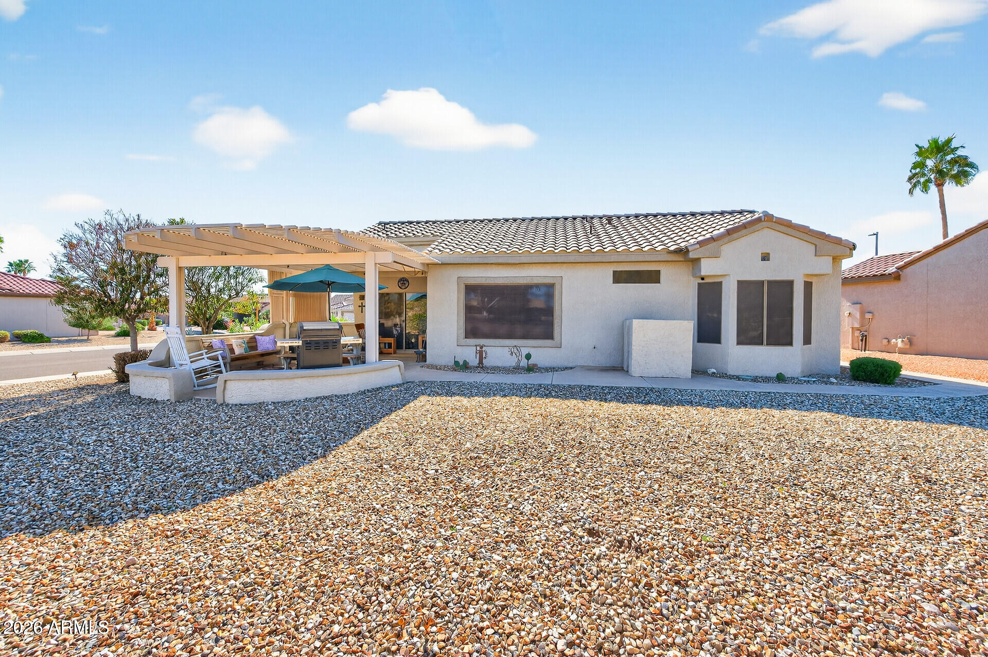 16100 West Eagle Ridge Drive Surprise, AZ 85374 - Photo 42 of 44 a front view of a house with a yard and a garage