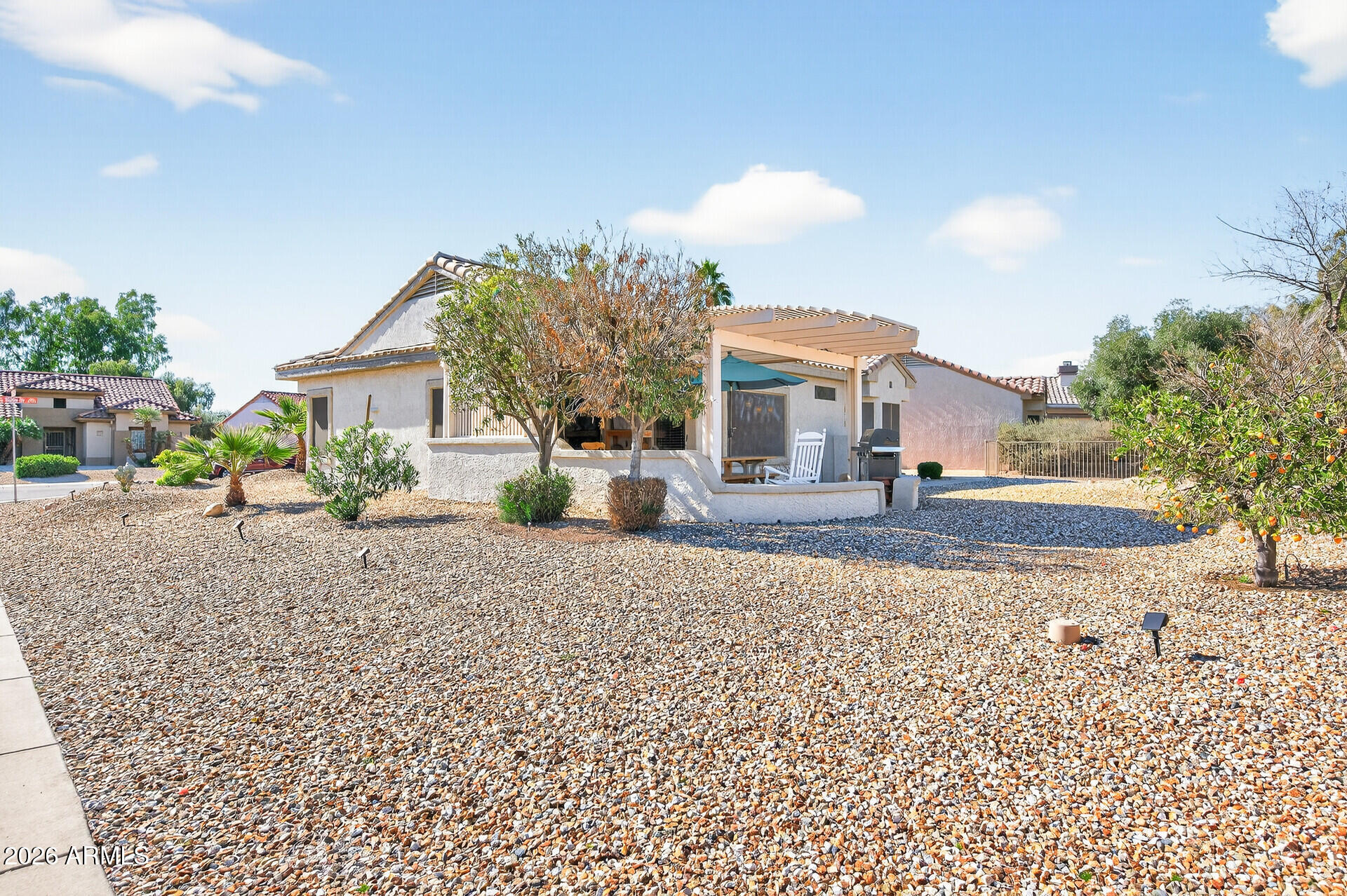 16100 West Eagle Ridge Drive Surprise, AZ 85374 - Photo 43 of 44 a front view of a house with a yard
