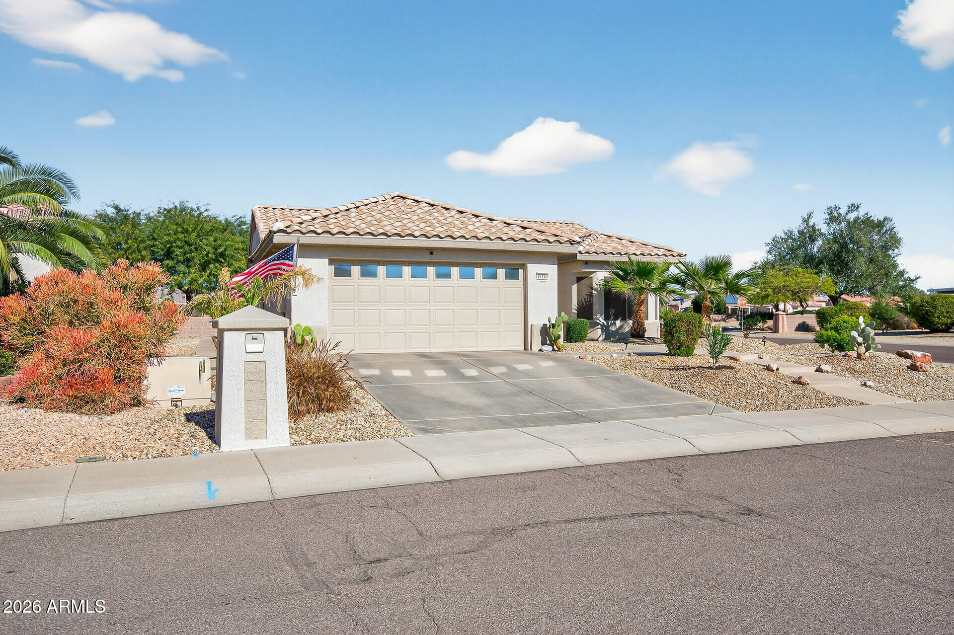 16100 West Eagle Ridge Drive Surprise, AZ 85374 - Photo 5 of 44 a front view of a house with a yard
