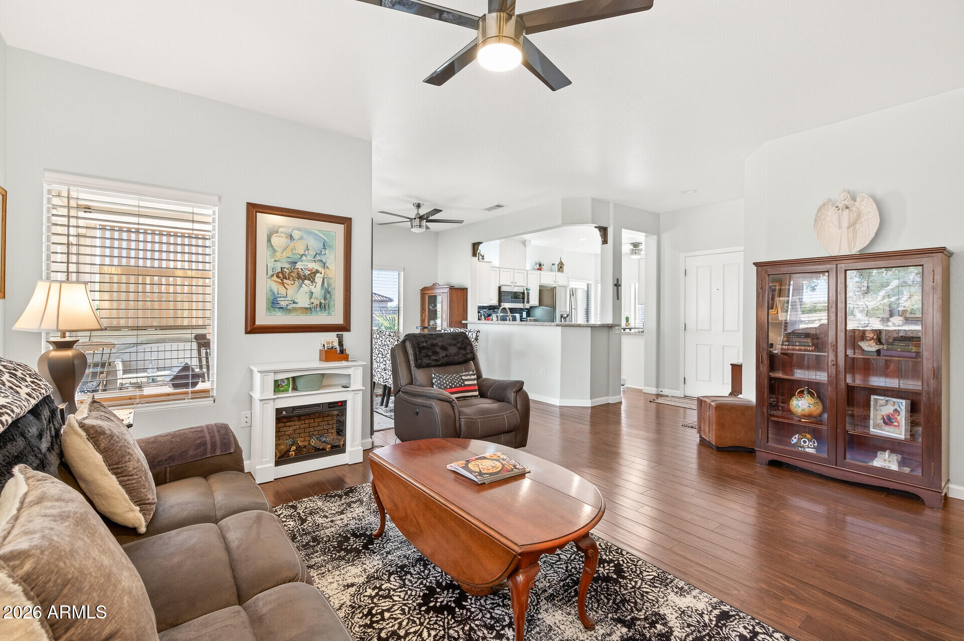 16100 West Eagle Ridge Drive Surprise, AZ 85374 - Photo 9 of 44 a living room with furniture and a fireplace