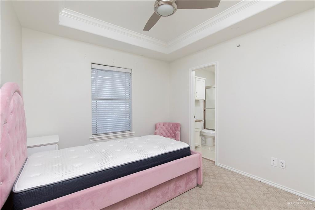 103 South 48th Lane, Unit 1 McAllen, TX 78501 - Photo 12 of 20 a bedroom with a bed and a window