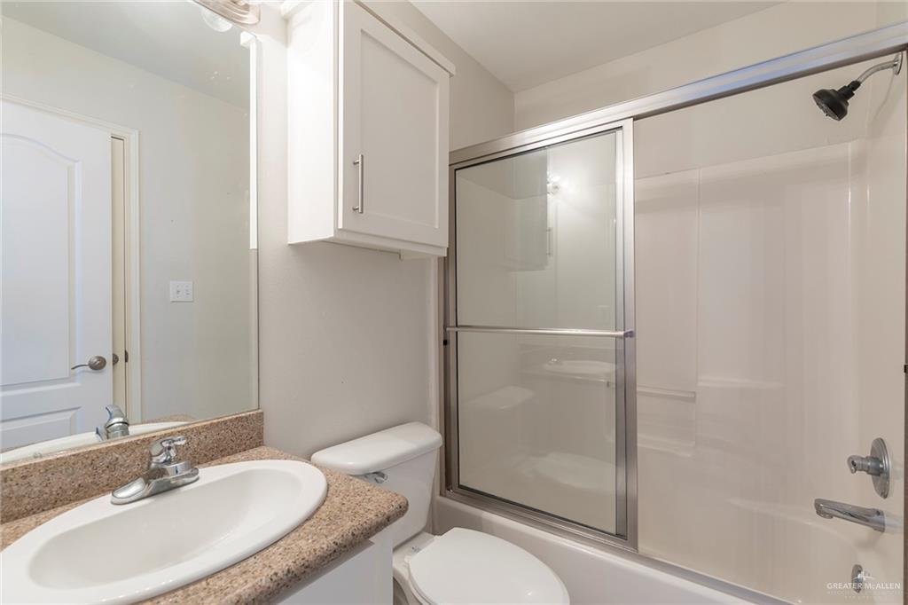 103 South 48th Lane, Unit 1 McAllen, TX 78501 - Photo 14 of 20 a bathroom with a sink toilet and shower