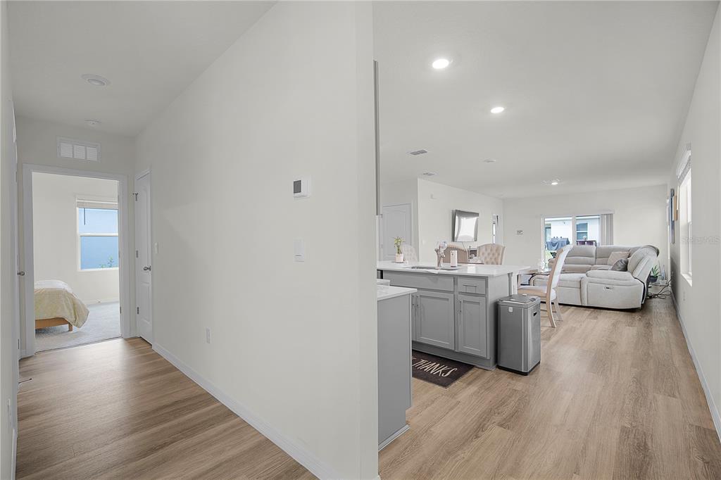 1606 Bull Hl Road Kissimmee, FL 34744 - Photo 13 of 38 a living room with furniture and a wooden floor