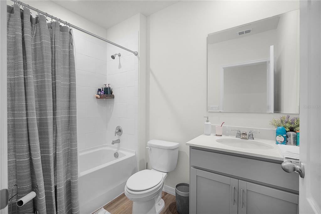 1606 Bull Hl Road Kissimmee, FL 34744 - Photo 14 of 38 a bathroom with a sink toilet and shower