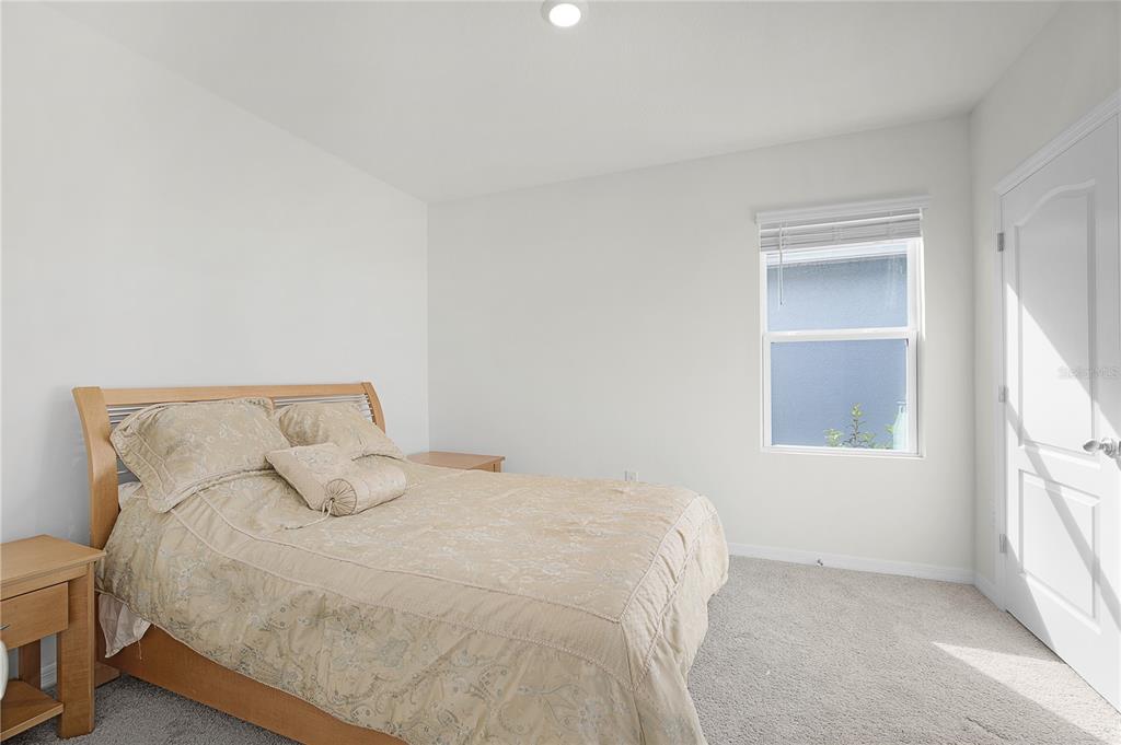 1606 Bull Hl Road Kissimmee, FL 34744 - Photo 16 of 38 a large bed sitting in a bedroom next to a window