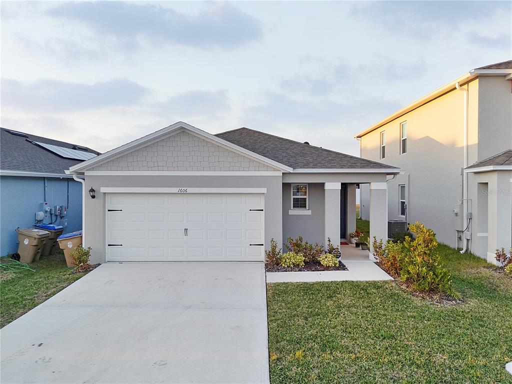1606 Bull Hl Road Kissimmee, FL 34744 - Photo 2 of 38 a view of a yard in front of a house