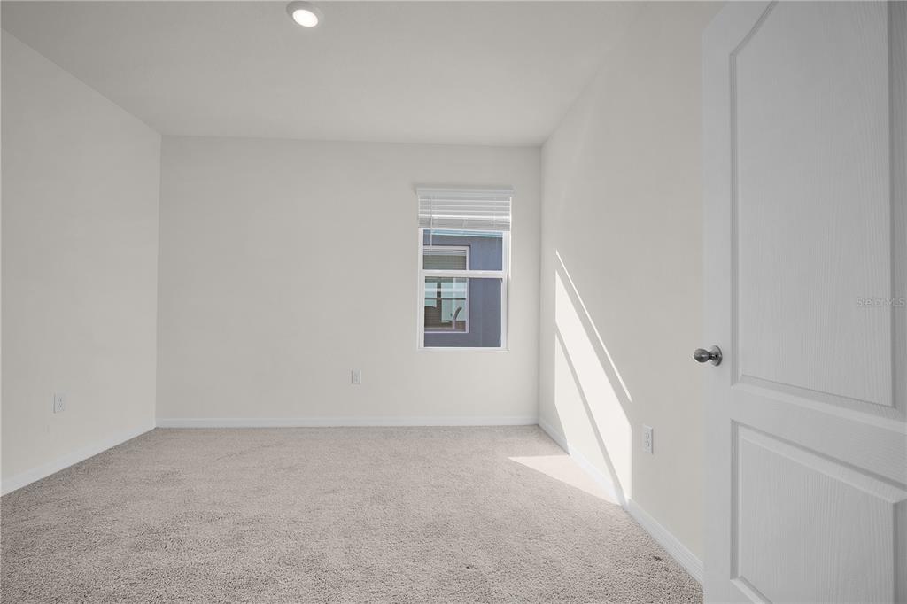 1606 Bull Hl Road Kissimmee, FL 34744 - Photo 23 of 38 an empty room with windows