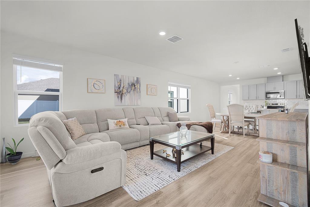 1606 Bull Hl Road Kissimmee, FL 34744 - Photo 26 of 38 a living room with furniture and a table